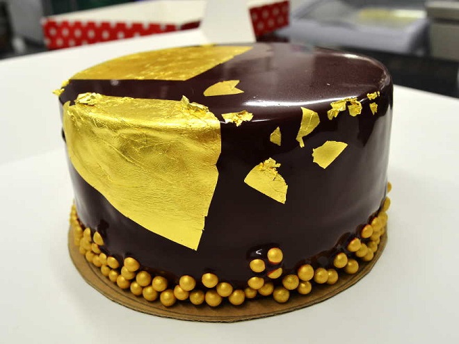 Chocolate cake adorned with gold leaf
