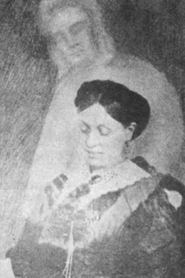 Black and white photo of Spiritualist Emma Hardinge Britten with the faded image of a man superimposed behind her