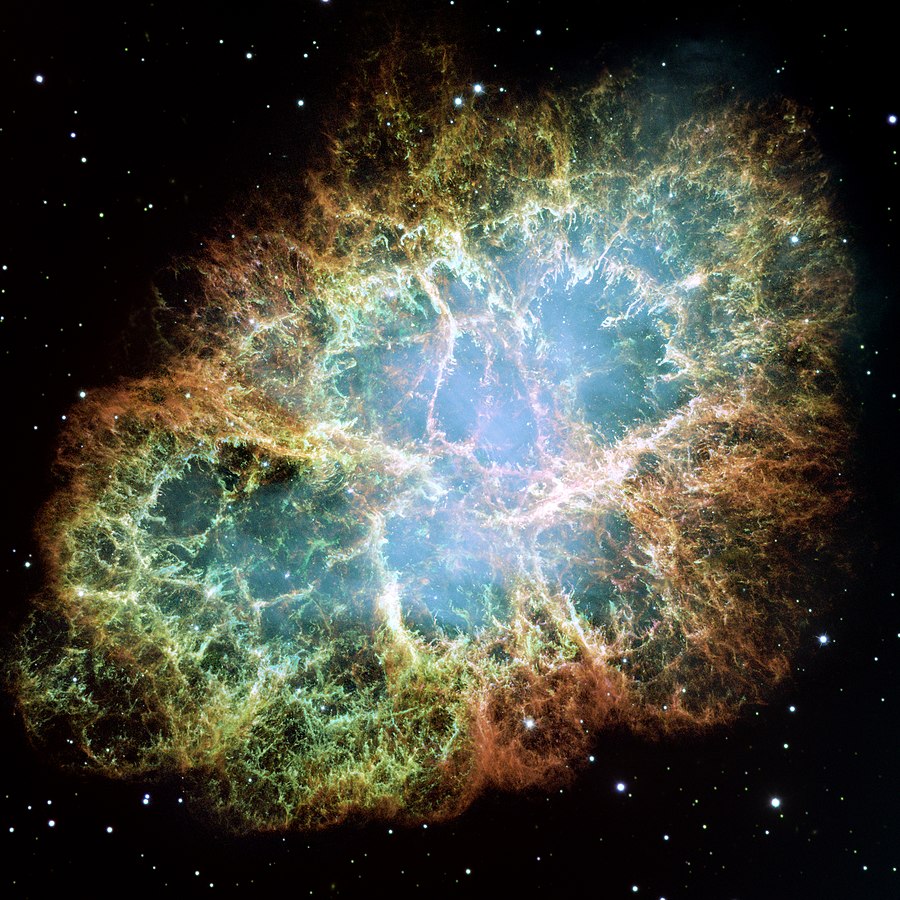 Brightly colored image of the remnant of a supernova explosion in space with bluish glow