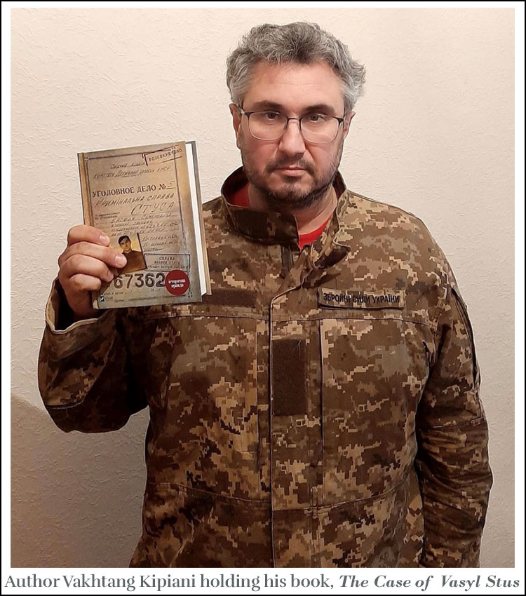 Vakhtang Kipiani holding his book, The Case of Vasyl Stus