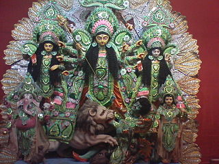 Durga Puja statues with Durga in middle