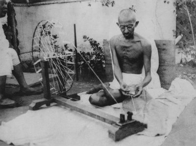Mahatma Gandhi working the charkha