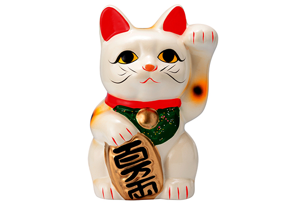 A white maneki-neko, the Japanese lucky cat figurine