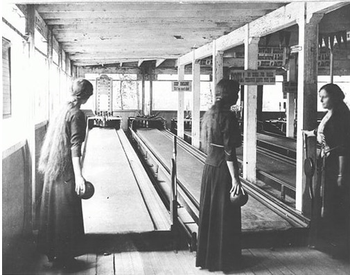 Women bowling in dresses 1915