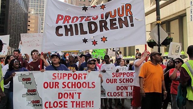 Teachers and parents protesting the closure of Chicago public schools