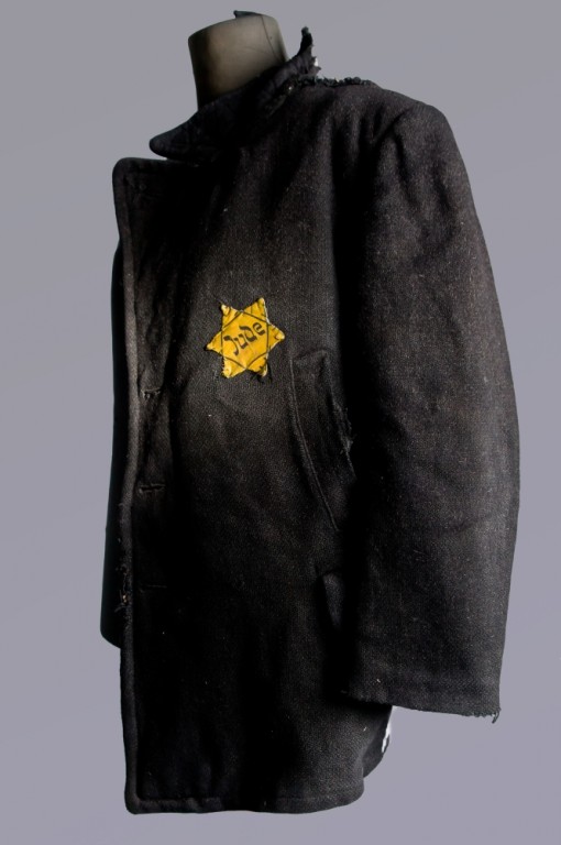 Coat with a Star of David patch on display at the Auschwitz Museum