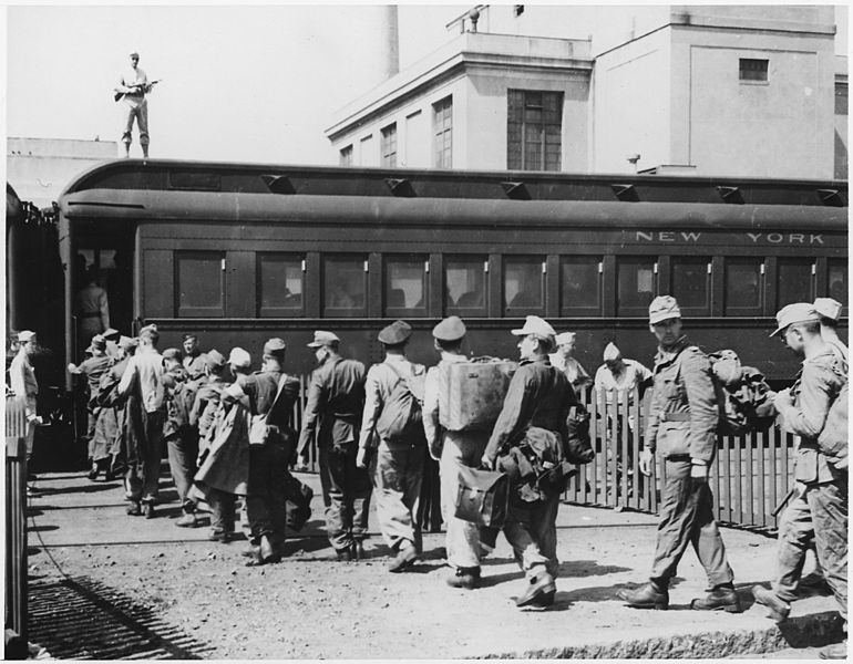 German POWs board a train in Boston during WWII