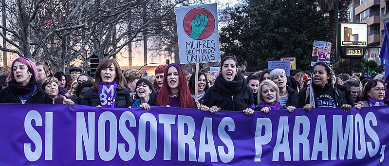 Women holding banner during 2018 Spanish women's strike in Zaragoza, Spain