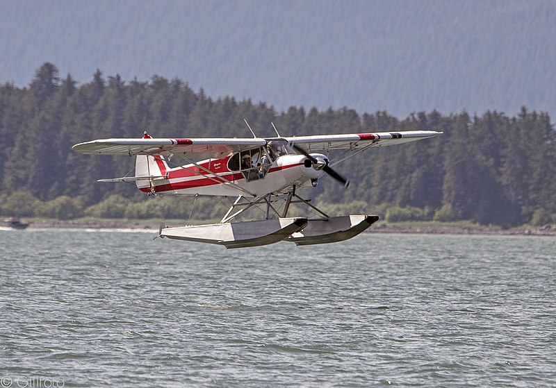 Piper Super Cub DL3157 airplane above water