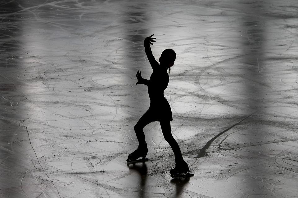 Silhouette of figure skater on ice