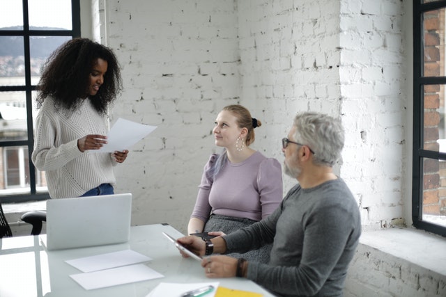 People of different ages working together in a modern office setting