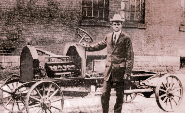 Black-and-white photo of the open frame of the first Patterson-Greenfield automobile, with engine visible