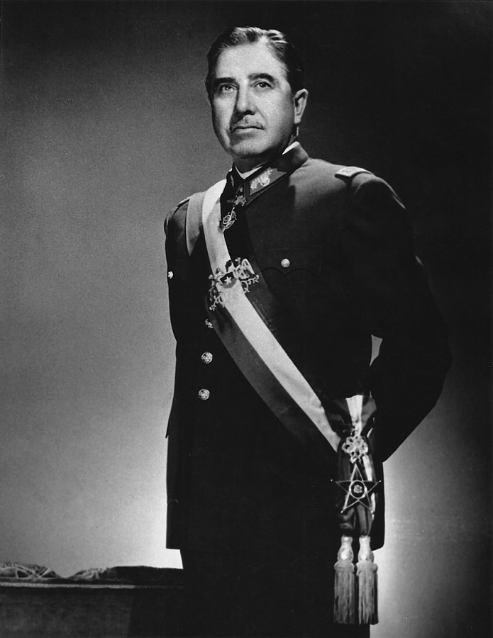 Black and white photo of Chilean dictator Augusto Pinochet in military regalia