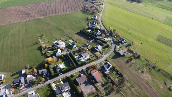 An aerial view of houses on a plot of land