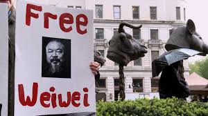 Poster featuring a photo of Ai Weiwei and the words Free Weiwei