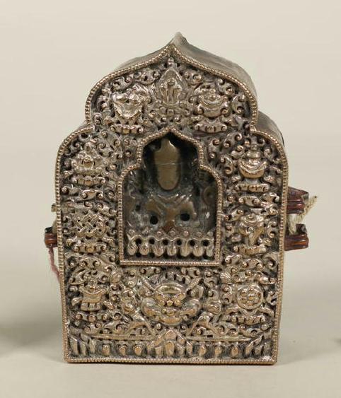 A small, intricately carved gau box
