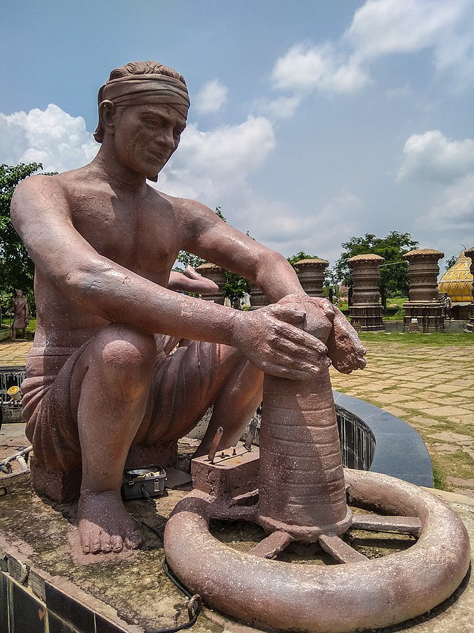 Bronze sculpture of a Kumhar man making pottery