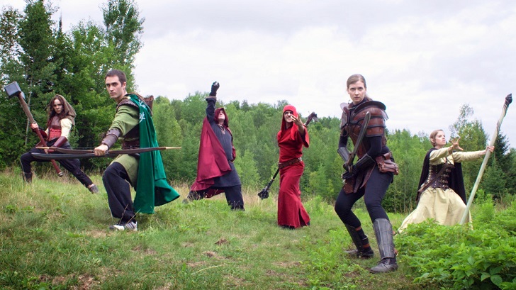 LARPers dressed in fantasy costumes weilding prop weapons
