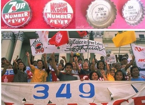 Demonstrators protesting Pepsi in the Philippines holding banners and picket signs