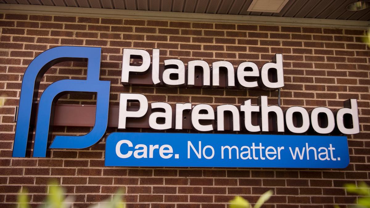 Exterior of Planned Parenthood clinic with sign that says Care. No Matter What