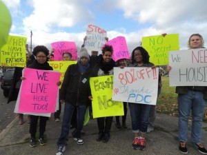 Demonstrators with signs protesting gentrification in Portland