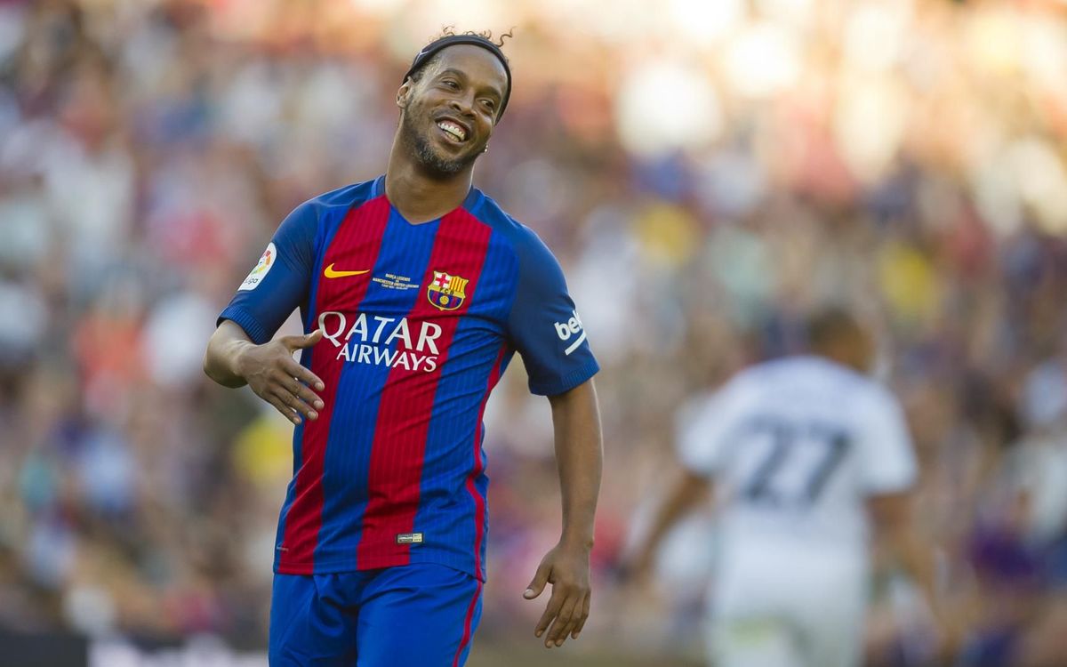 Soccer player Ronaldinho wearing soccer uniform and smiling