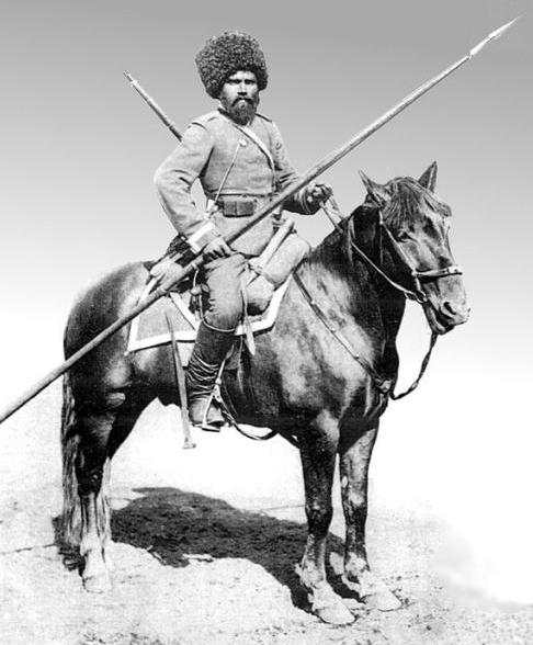 Black and white photograph of a Cossack in military uniform on horseback circa 1890s