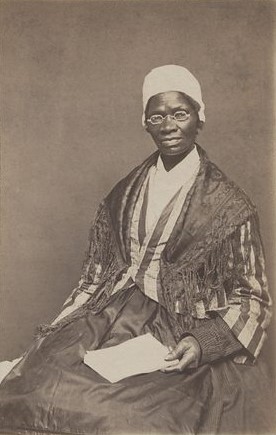 Albumen silver print portrait of Sojourner Truth in the 1850s, showing her seated with paper in hand