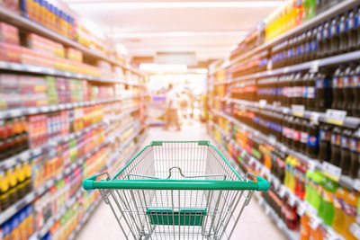 empty supermarket aisle with shopping cart