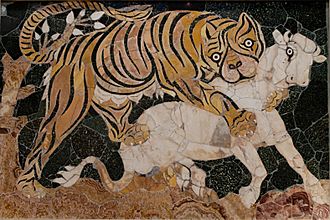 A marble artwork of a tiger attacking a calf